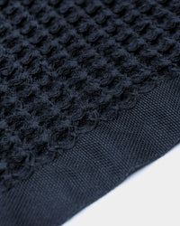 A close-up image of the ONSE Twilight Blue Waffle Bath Towel.