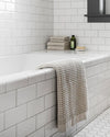 The ONSEN Oatmeal Waffle Bath Sheet Set in a bathroom setting.