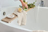 Stylish accessories for spa-like relaxation in the bathroom with natural elements and practical items.
