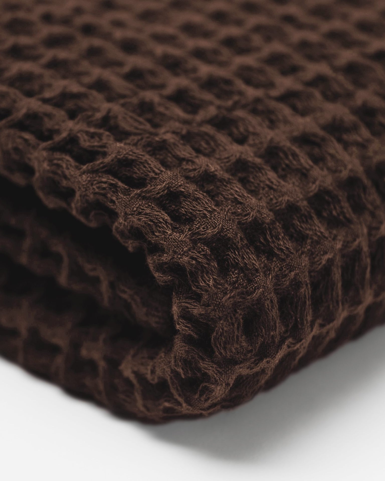 Close up of the Onsen Waffle Towel in Brown #color_brown