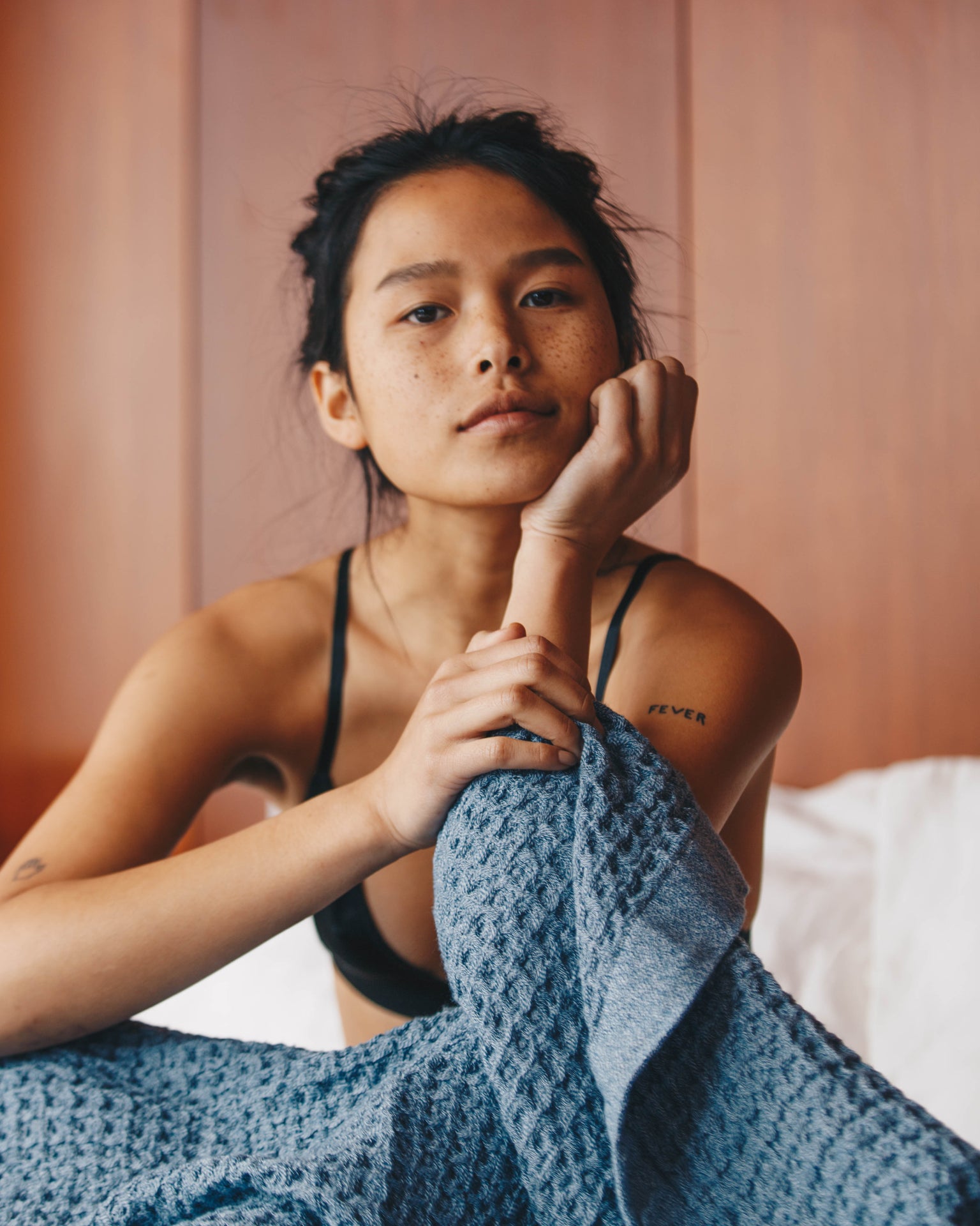 A girl with the Onsen Waffle Towel in Denim #color_denim