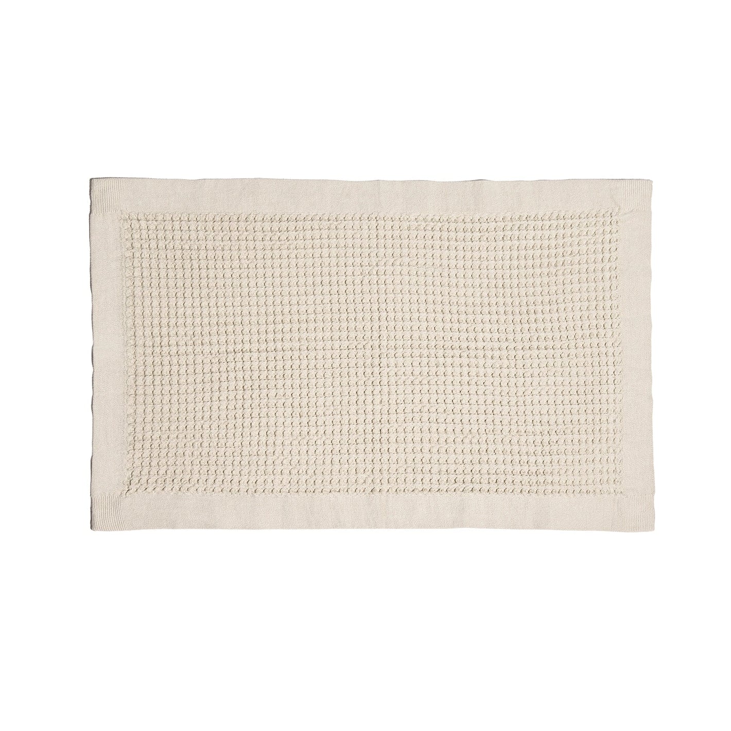 Beige bath mat on a white background