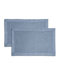 A waffle bath mat with a textured weave pattern.