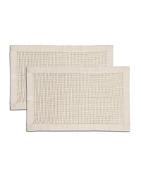 A waffle bath mat with a textured weave pattern.