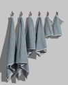Sculpted Terry 6pc Towel Bundle displayed in a stacked arrangement showcasing plush texture and modern design.