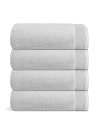 Plush Bath Sheet stacked neatly, made of soft Aegean cotton for a luxurious post-shower experience.