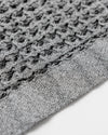 A close-up image of the ONSEN Cinder Grey Waffle Towel.