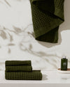 The ONSEN Forest Waffle Towel Set in a bathroom setting.