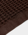 A close-up image of the ONSEN Brown Waffle Towel on a white background.