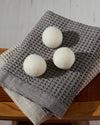 The ONSEN Wool Dryer Balls on Waffle Towels.